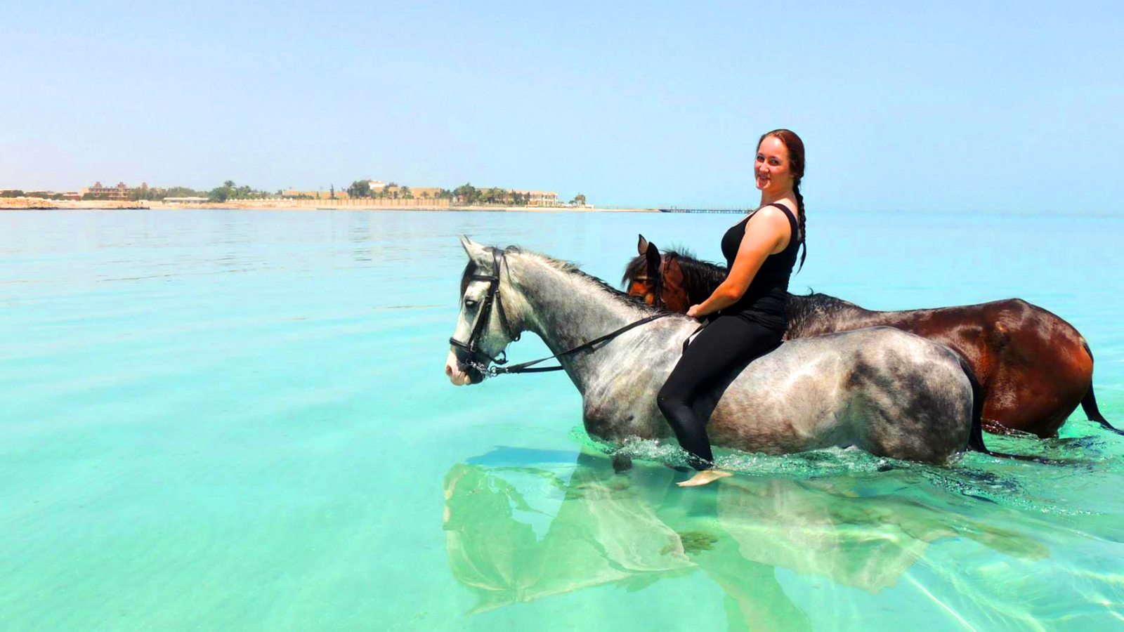 girl2horsesswimming-1600x900